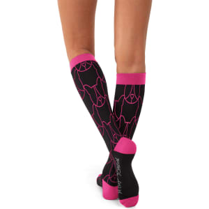 A pair of black compression socks with pink detailing, featuring a dog design and a logo.