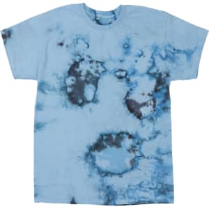 A blue tie-dye T-shirt featuring irregular patterns in darker shades of blue and black. The shirt has a logo on it.
