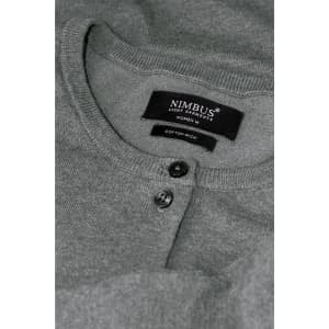 A grey cardigan with a round neckline and button details, featuring a label with branding.