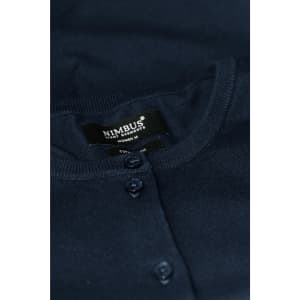 A dark navy cardigan with button closures and a brand label visible.