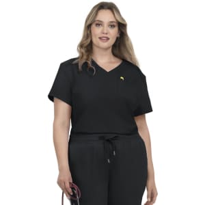 A woman wearing a black V-neck top with a pocket, featuring a subtle branding logo.