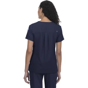 A navy blue short-sleeve top with a pleat detail at the back, featuring a logo on one sleeve.