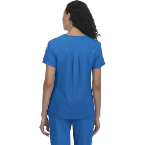 A blue medical top with a relaxed fit and a pleat detail on the back. It features a branding logo.