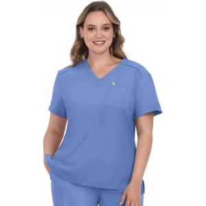 A scrub top in a light blue colour, featuring a V-neck and a chest pocket, worn by a model with wavy hair.