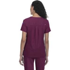 A jersey top in burgundy, featuring a pleated back design and short sleeves. It has a logo on the sleeve.