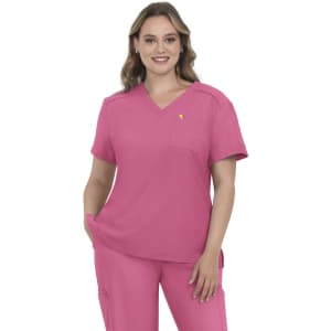 A top in vibrant pink featuring a V-neck design and a pocket, worn by a model with wavy hair.