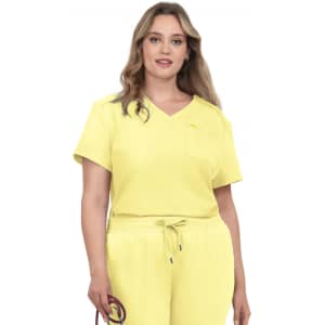 A model wearing a yellow V-neck top with a pocket, paired with matching yellow joggers.
