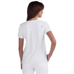 A white women's top with a round neckline and short sleeves, featuring a back pleat detail and a logo.