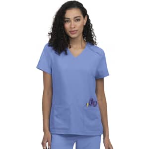 A scrubs top in light blue featuring short sleeves and two front pockets with a logo on the chest.