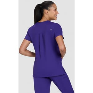 A purple women's top is worn by a model from a rear view, featuring short sleeves and a relaxed fit.