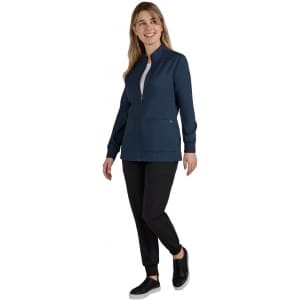 A navy women's jacket with a zip front and two side pockets, paired with black pants and sneakers.