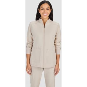 A beige women's jacket featuring a zip front and pockets, modelled by a woman with long hair.
