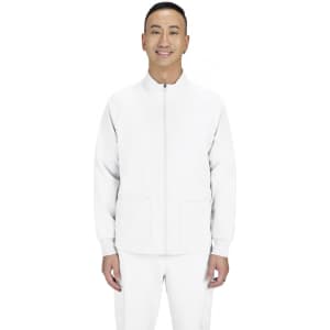 A white jacket with a zip front and two pockets, worn by a model standing and smiling. The jacket has a logo.
