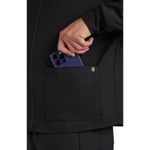 A black jacket with a pocket, featuring a person placing a smartphone inside the pocket.