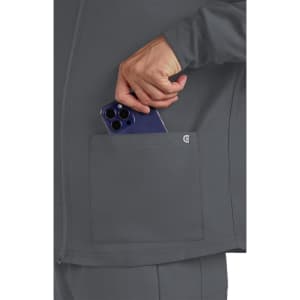 A grey men's jacket featuring a side pocket, with a hand placing a smartphone into the pocket.