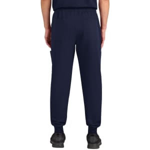 A pair of navy jogger pants featuring elastic cuffs and multiple pockets, shown from the back.