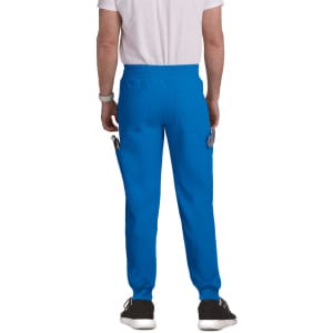 A pair of blue jogger pants with a waistband and pockets, viewed from the back. The model is wearing a plain white t-shirt.