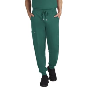 A pair of green jogger pants with side pockets and an elastic waistband, featuring a logo on the front.