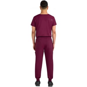 A maroon jogger set featuring a short-sleeve top and matching pants, with a logo on the back.