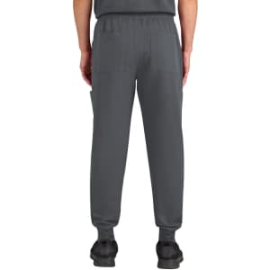 A pair of grey jogger pants featuring pockets, with a tapered fit and elastic waistband.