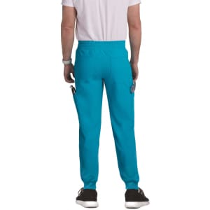 A pair of turquoise joggers featuring side pockets and a relaxed fit, seen from the back.