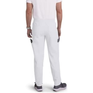 White cargo pants with side pockets, featuring a relaxed fit and an elastic waistband, worn by a person from behind.