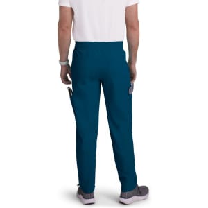Teal cargo pants with a relaxed fit, featuring multiple pockets and an elastic waist, worn by a person from behind.