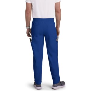 A pair of blue cargo pants featuring pockets, worn by a person from the back, with a logo visible.