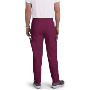 A pair of maroon cargo pants with a waistband, featuring side pockets, modelled by a person from the back.
