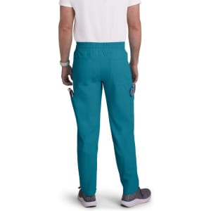 Teal cargo pants with pockets, featuring an elastic waistband, worn by a person from the back.