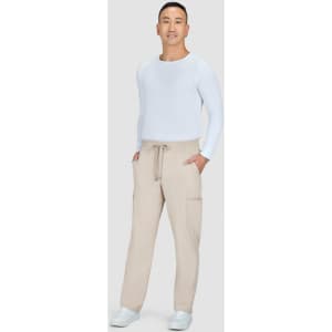A person wearing beige Neuro Cargo Pants and a white long-sleeve top, standing against a plain background.