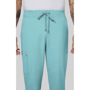 A pair of aqua blue cargo pants with an elastic waistband and multiple pockets, featuring branding.