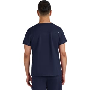 A navy-blue medical scrub top with a simple design and a logo on the back.