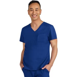A blue medical scrub top with a V-neck and a chest pocket, worn by a smiling individual.