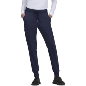 Navy jogger pants with elastic cuffs and side pockets, featuring a drawstring waist. Includes a logo on the front.