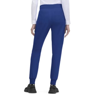 A pair of blue jogger pants with elastic cuffs and pockets, featuring a branding logo on the back.