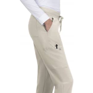 Beige jogger pants featuring side pockets, a drawstring waistband, and a light fabric design.