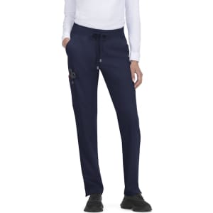 Atria Pant in navy, featuring a drawstring waist and side pockets. Comes with a small logo on the hip.