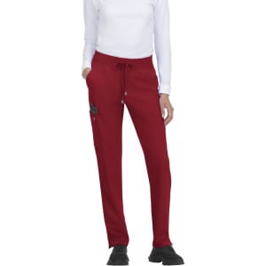 Red athletic pants with a drawstring waist and pockets, featuring a logo on the side.
