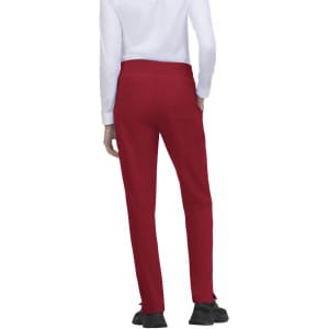 Atria Pant in red, featuring a simple design with a back view and pockets. Also includes a logo.