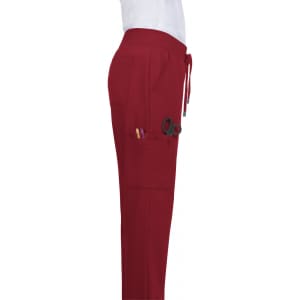 Atria Pant in burgundy, featuring multiple pockets and a drawstring waist, shown from the side.