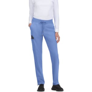 Atria Pant in light blue, featuring a drawstring waist and logo branding, showcased on a model standing.