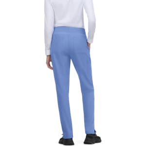 A pair of blue pants with a fitted design, featuring pockets, viewed from the back. Includes a visible logo.
