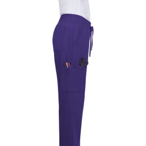 Atria Pant in purple, featuring side pockets and a drawstring waistband. The product includes a logo on the waistband.
