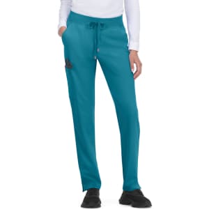 Atria Pant in teal, featuring a drawstring waist and pockets, worn by a model with a long-sleeved top.