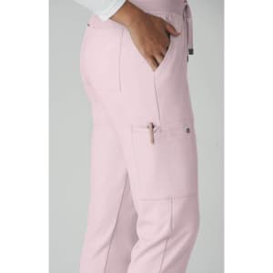 A pink pant featuring a pocket detail and a side pen holder, designed for utility and comfort.