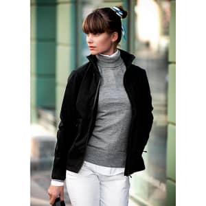 A black women's jacket is worn over a grey sweater, paired with white trousers, featuring a collar and a zip.