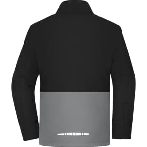A softshell jacket in black and grey, featuring a logo on the back, designed for workwear purposes.