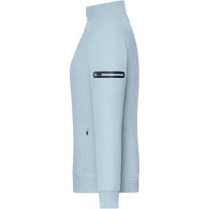 A light blue zip jacket with a high collar and an arm pocket, featuring a logo.