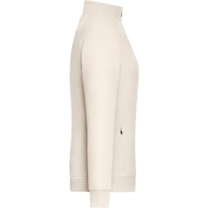 A light beige zip jacket with a high collar and side pockets. The jacket has a logo on it.